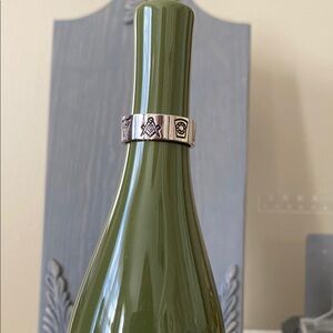 Silver tone Masonic ring features seven symbols. Measures approximately 12 1/2.